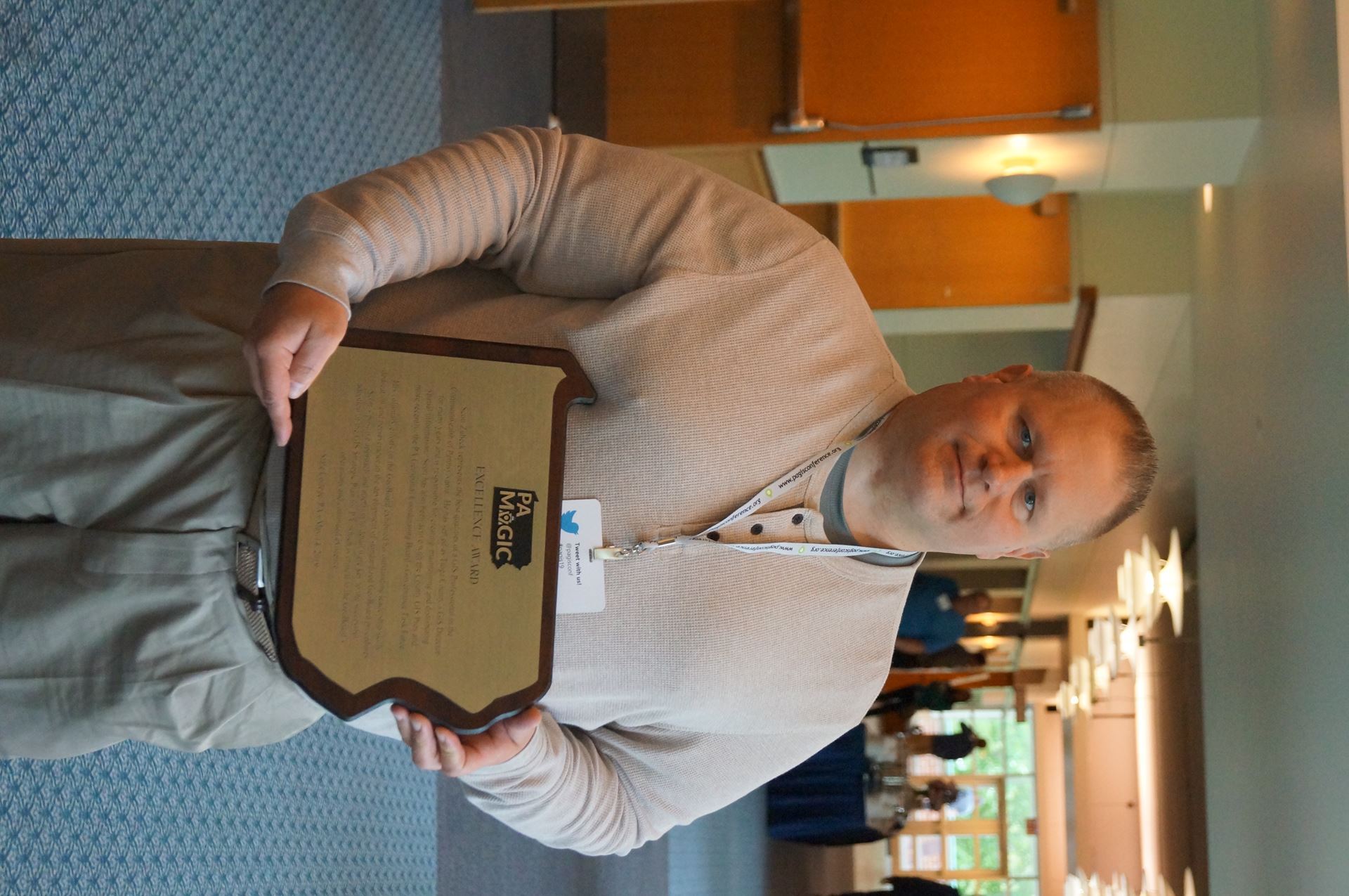 scott zubek holding excellence award