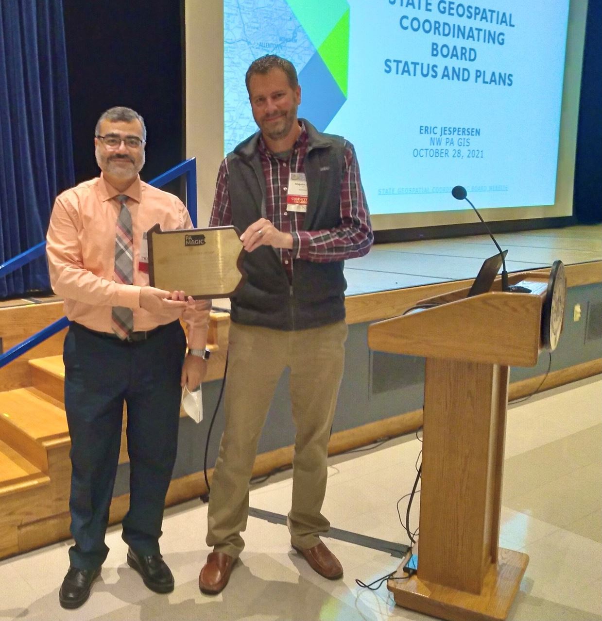 dr. ayad and mark maguire with excellence award
